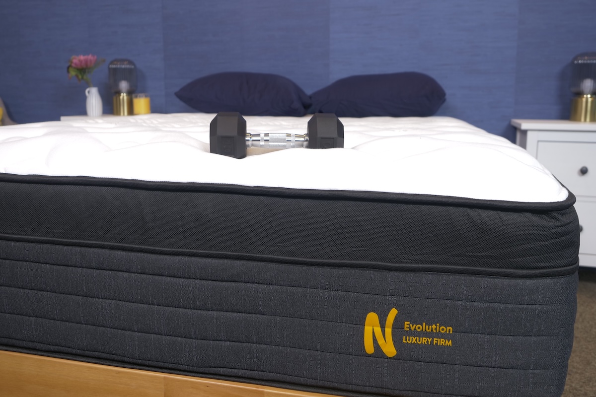 Nolah Evolution hybrid Mattress with heavy weights on top to test for motion transfer and plushness